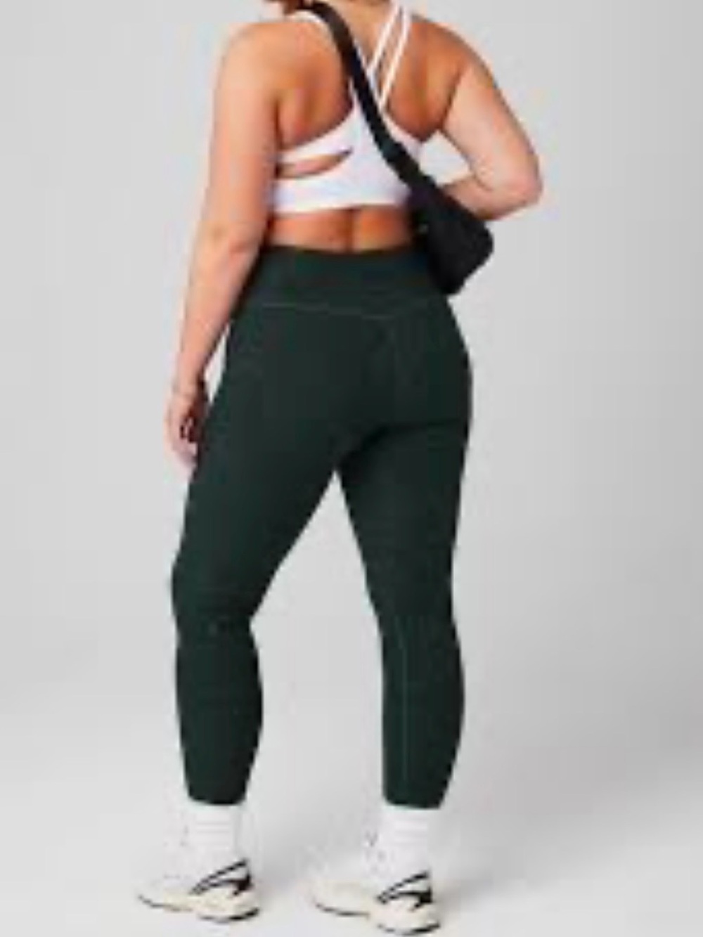 Fabletics HeatherFlex High-Waisted Crop Leggings in a green heathered pattern